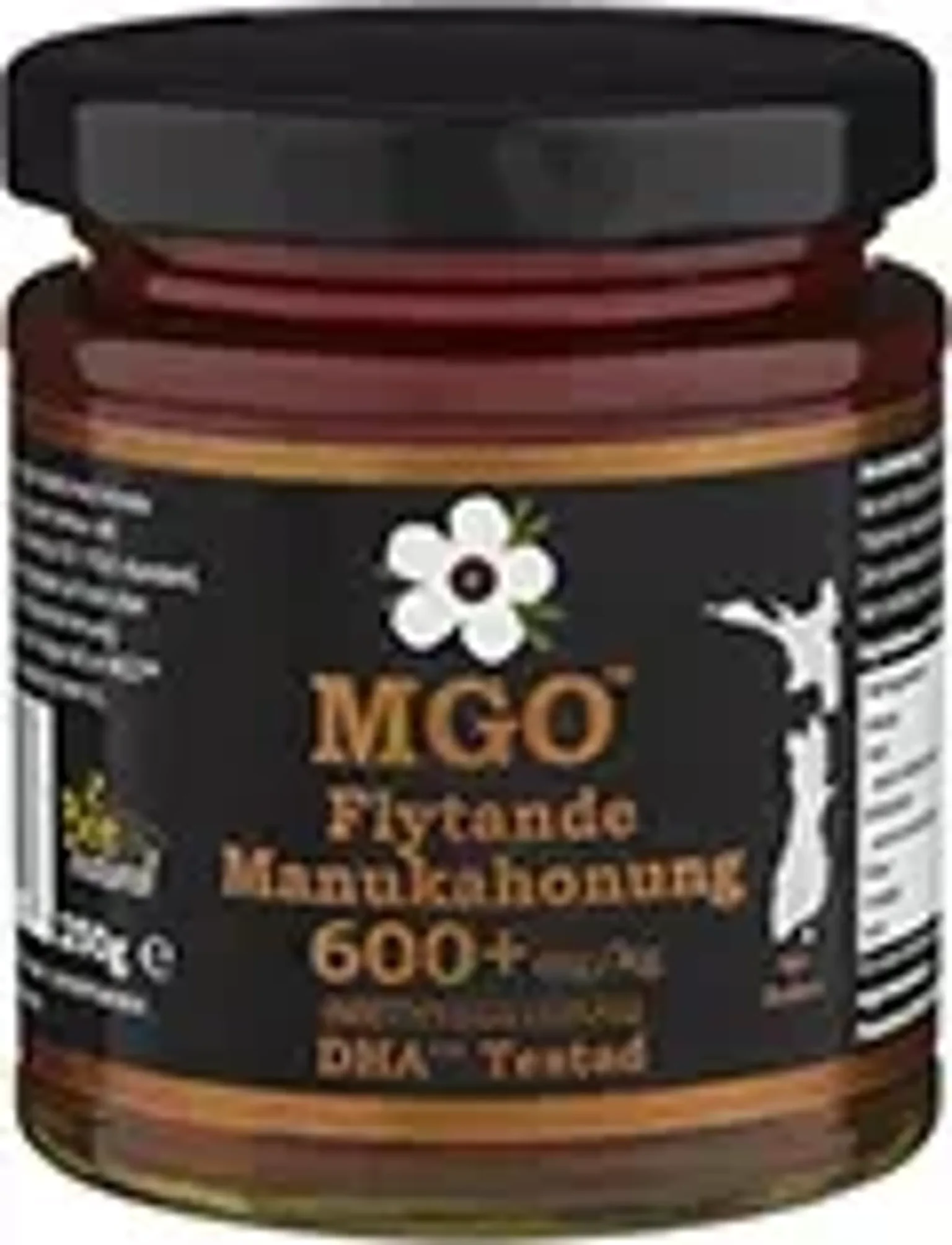 En burk med Manukahonung med en etikett som visar MGO 600+ och information om produkten.
